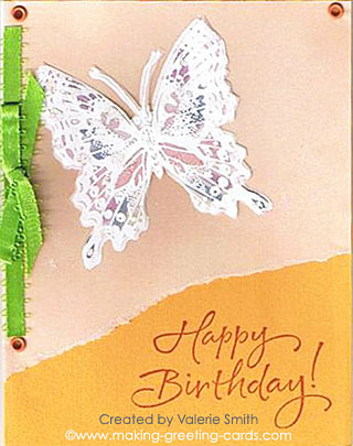 Sending Happy Birthday wishes with butterfly and ribbon.