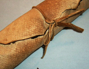 Mother's Poem all rolled up and tied with  a leather string.