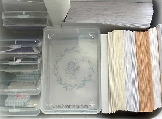 Box of envelopes, folded blank cards, and other items for cardmaking. Pricing homemade cards - cardstock, envelopes, etc