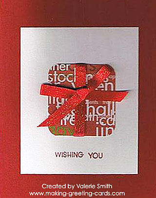 This Christmas card created by Valerie is beautiful. I love this shade of red she used and the touch of gold and the red ribbon on the present to accentuate the whole design. Lovely! Red Christmas Card with gift tied with a red ribbon.